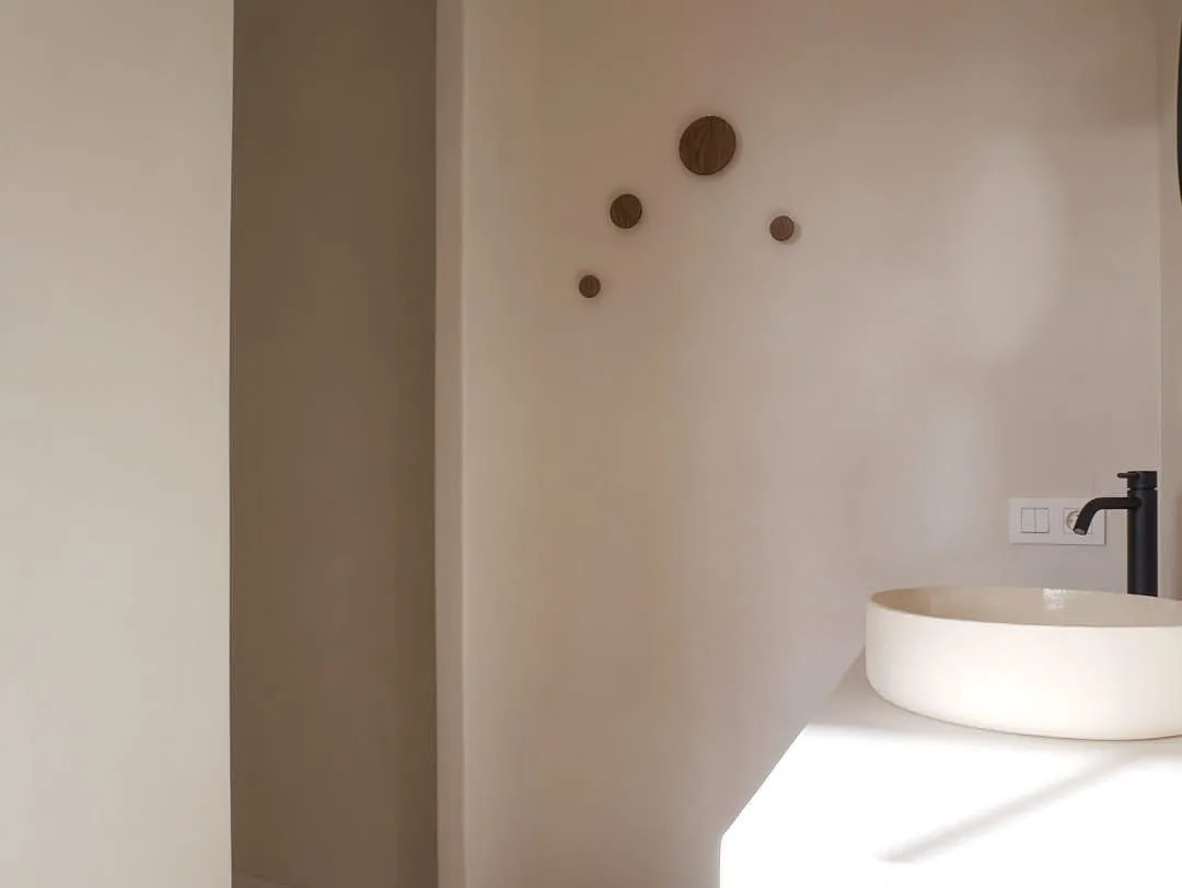 A handmade porcelain washbasin in soft daylight