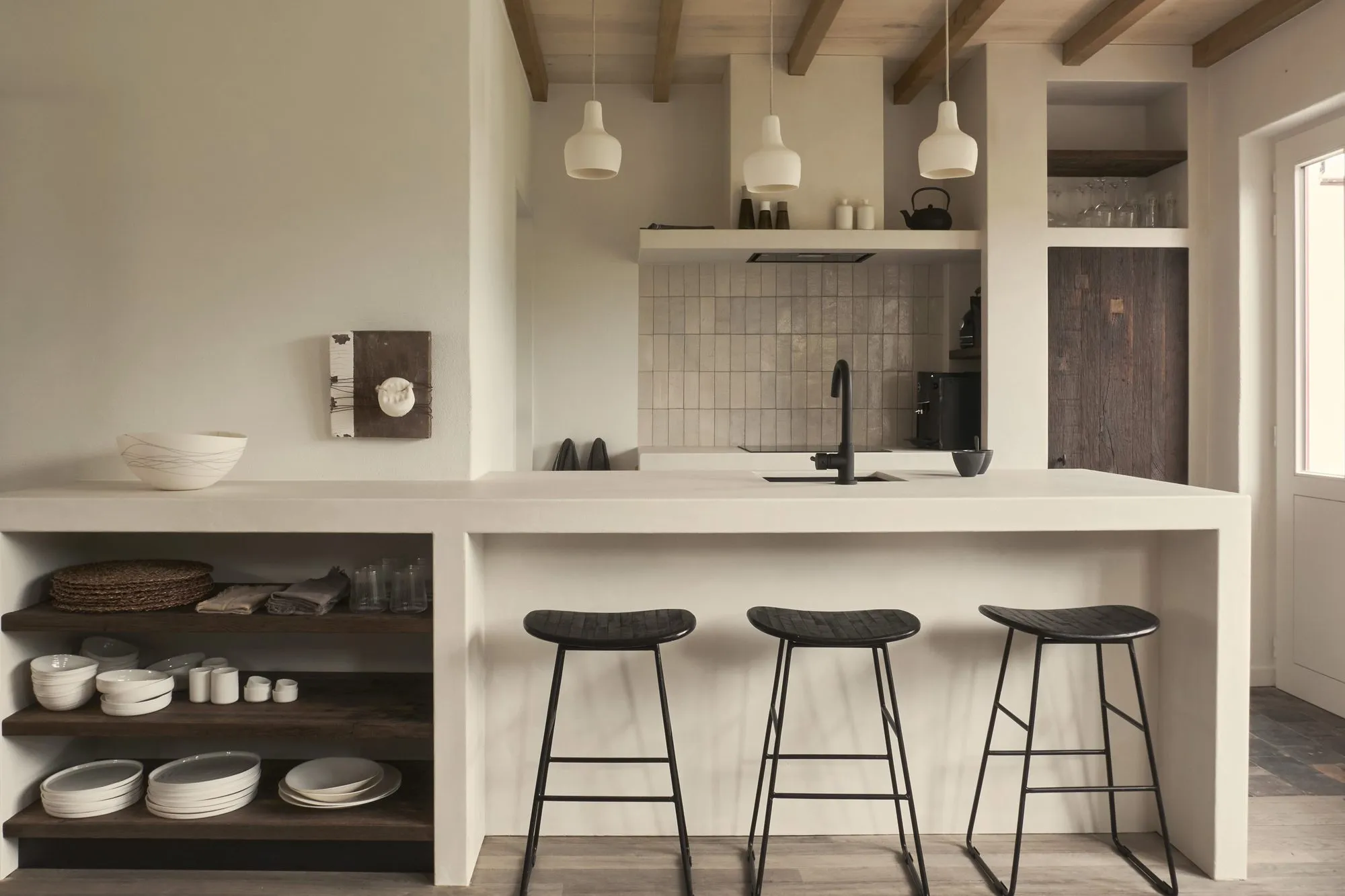 The kitchen at MaDammeKeramiek in Damme, with Sophie's handmade ceramics on open shelving